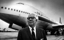 Load image into Gallery viewer, Donald Nyrop posing in 1970 with a new Boeing 747 at Minneapolis-St. Paul International Airport.